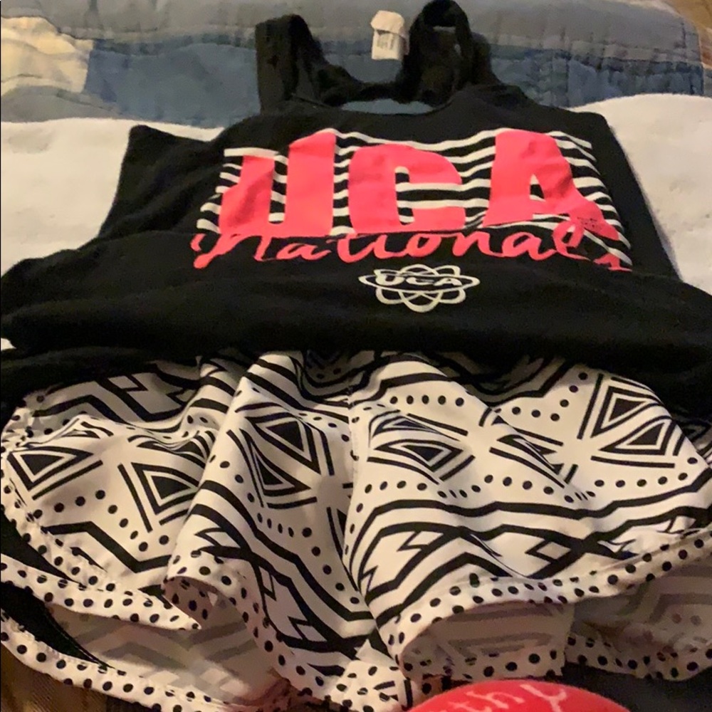 UCA Cheer top and matching nylon shirts.